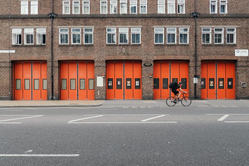 red fire station doors on london street