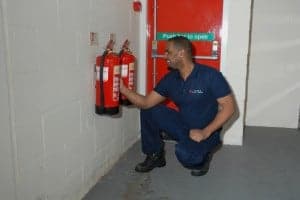 fire extinguishers being serviced