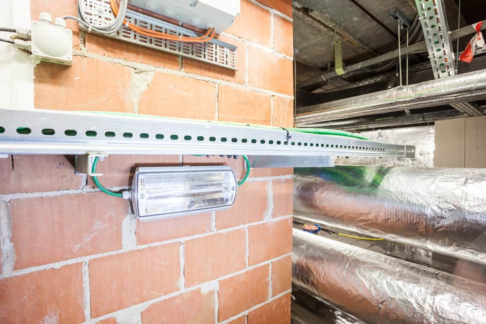 emergency lighting regulations for a fitting below a cable duct